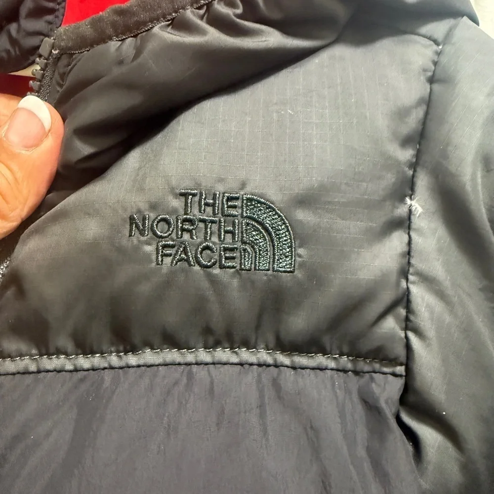 The North Face Kids Black and Red Puffer Jacket. Two-sided black and red
